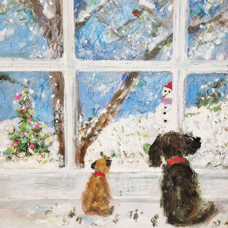 Christmas pack by Jenny handley. Two little dogs looking out of a window at a snowy scene with a snowman and a Robin.