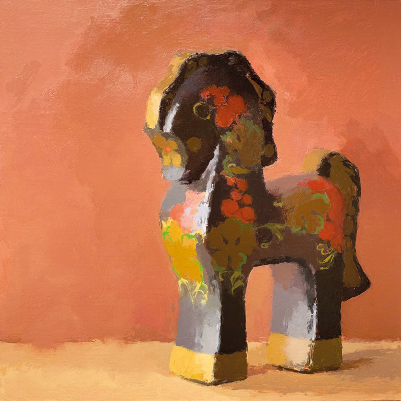 Art Greeting card by Anne Waller. Painting of a patterned, wooden toy horse with a peach background.