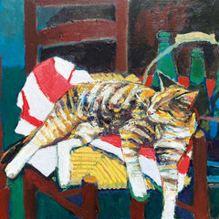 Art greeting card by Howard Milton. Toitoiseshell cat lying asleep on colourful cushions on a brown wooden chair.