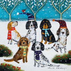 Art greeting cards by Louise Rawlings. A group of dogs sitting in the snow. They are wearing Christmas hats and scarves. There are trees and a Robin.