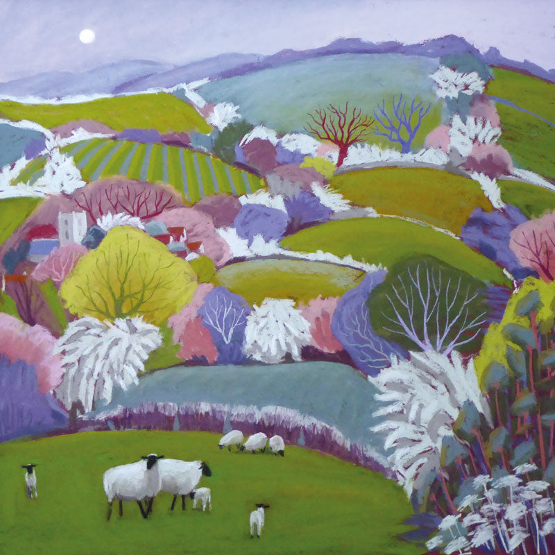 Colourful landscape with green hills and trees with sheep and lambs.